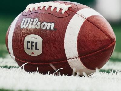 CFL football on a field