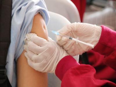 Person receiving COVID-19 vaccine